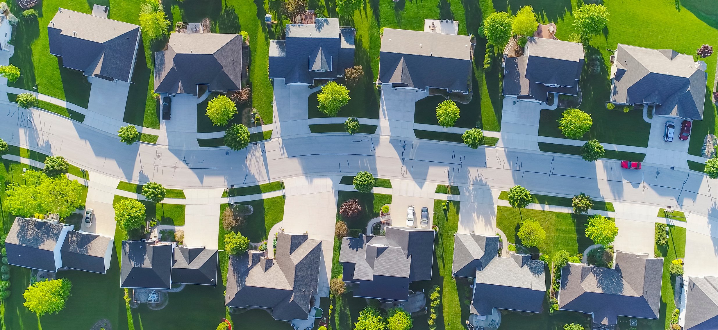 Idyllic neighborhood street, aerial view